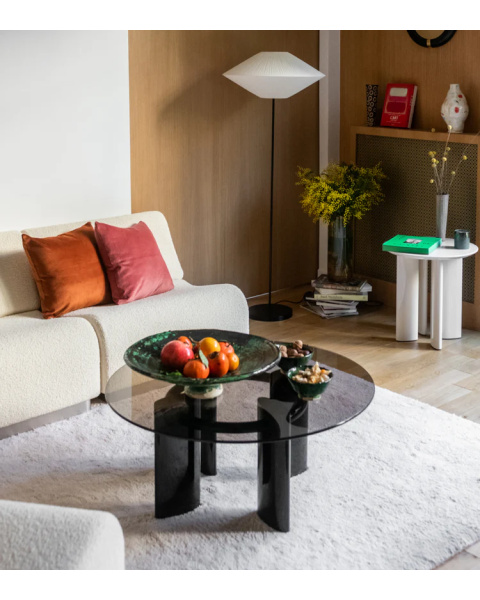 Round glass coffee table with black legs Round glass coffee table with black legs