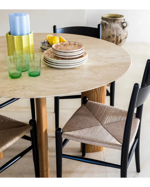 Round travertine coffee table with iroko finish legs Round travertine coffee table with iroko finish legs