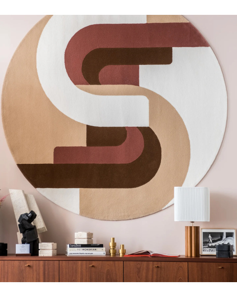 Beige and pink round wool rug