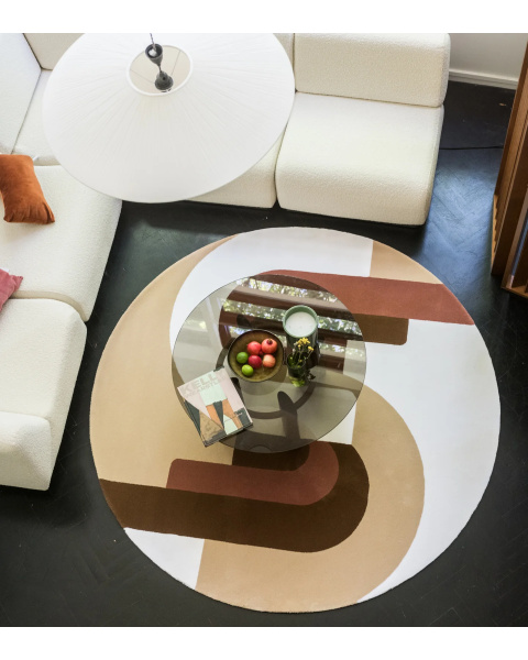 Beige and pink round wool rug