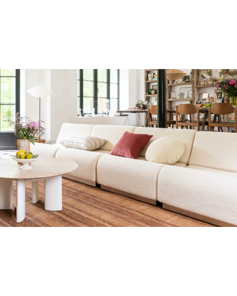 Cream white armchair in bouclette wool with a modular steel base